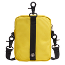 A bright yellow canvas crossbody bag with a central black webbing strap, black metal clasp at the top, and an adjustable black shoulder strap on both sides, shown against a plain white background.