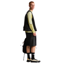 Person wearing a black and yellow outfit with a backpack on a white background