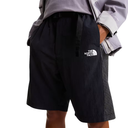 Black shorts with The North Face logo worn by a person on a white background