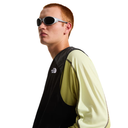 Man wearing sunglasses and a black and yellow outfit on a white background