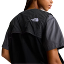Person wearing a black and gray shirt with The North Face logo on the back