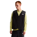 Person wearing a black vest with The North Face logo on a white background