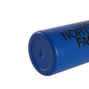 A close-up of a blue cylindrical product, likely a tumbler or can cooler, showing the bottom circular base and embossed black text reading 'THE NORTH FACE' on a plain white background.