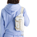 Person wearing a light blue hoodie with a white crossbody bag.