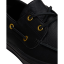 Close-up of a black leather boat shoe with black laces and gold eyelets on a white background.