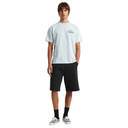 Person wearing a light blue t-shirt and black shorts on a white background