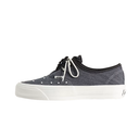 A low-top Vans platform sneaker in dark gray denim canvas with black laces, white laces, and a thick white platform sole, shown from a side profile on a white background.