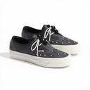 A pair of Vans platform sneakers in washed black canvas with white laces, white platform soles, and silver metal studs, shown on a white background.