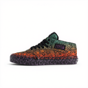 A low-top Vans with a Halloween-themed skull pattern gradient transitioning from green to orange, featuring black laces and a patterned sole.