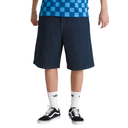 Person wearing blue checkered shirt, dark denim shorts, and black and white sneakers on a white background