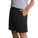 Person wearing black shorts with a white background