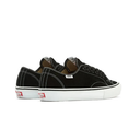 A pair of black suede low-top sneakers with white rubber soles, white contrast stitching, and red Vans side labels, shown against a plain white background.