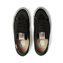 A pair of black Vans Old Skool sneakers shown from a top-down view on a white background, featuring white contrast stitching, white laces, and a colorful 'Vans x Off-White' collaboration label on the tongue.