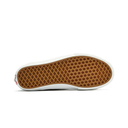 The bottom sole of a classic Vans slip-on shoe, showing the brown waffle grid tread and white rubber edge on a clean white background.