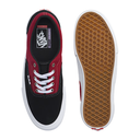 Black and red sneaker with a brown sole on a white background