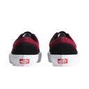 A pair of Vans platform sneakers shown from the back, featuring a black suede toe cap, a red canvas upper, and a thick white platform sole with the classic red Vans logo.