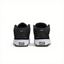 A pair of black Vans high-top sneakers shown from the back, featuring a black upper, white midsoles, and the classic Vans logo on the heel.