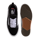 Black and white sneaker with brown sole on a white background