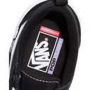 Close-up of a Vans shoe with visible branding on a white background