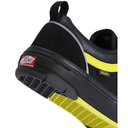 Close-up of a Vans waterproof shoe in black with a bright yellow accent stripe and a red Vans 'Not Just a Wall' sticker on the heel.