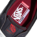 Close-up of a Vans Pop Cush skateboarding shoe showing the dark navy leather upper, burgundy mesh footbed, and white Vans logo on the insole.