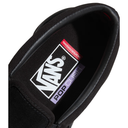 Close-up of a black shoe with a visible Vans logo on a white background