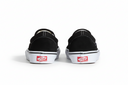 Black slip-on shoes with red labels on a white background