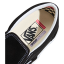 Close-up of a black Vans sneaker with a visible brand logo on the insole.