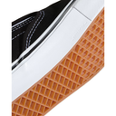 Close-up of a shoe sole with orange tread pattern on a white background