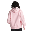 A person shown from the back wearing a light pink pullover hoodie with black text printed across the inside of the hood. The background is a clean, solid white.