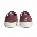Maroon sneakers with white sole on a white background
