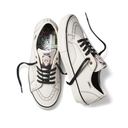 A pair of white Vans platform sneakers with black laces and black trim, displayed on a clean white background.