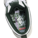 Close-up of a Vans Pop Cushion skateboard sneaker showing the inner collar with dark green lining, white mesh upper, and the Vans logo on the insole.