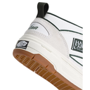 Close-up of a Vans Haulback sneaker showing the heel and side details, featuring a white leather and mesh upper with dark green piping, a cream midsole, and a brown gum outsole.