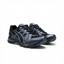 A pair of athletic running shoes in metallic navy blue and black, featuring mesh panels, synthetic overlays, and a thick cushioned sole, photographed on a clean white background.