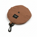 Brown packable hat with a black tag and clip on a white background