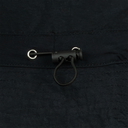 Close-up of a black leather strap with metal buckle on a dark fabric background