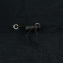 Close-up of a black leather strap with metal buckle on a dark fabric background