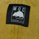 Black patch with 'MOC' and rat illustration on a mustard yellow background