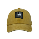 Yellow cap with a black patch featuring a logo and text on a white background